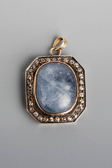 Appraisal: A SAPPHIRE AND DIAMOND SET PENDANT oval cabochon cut sapphire