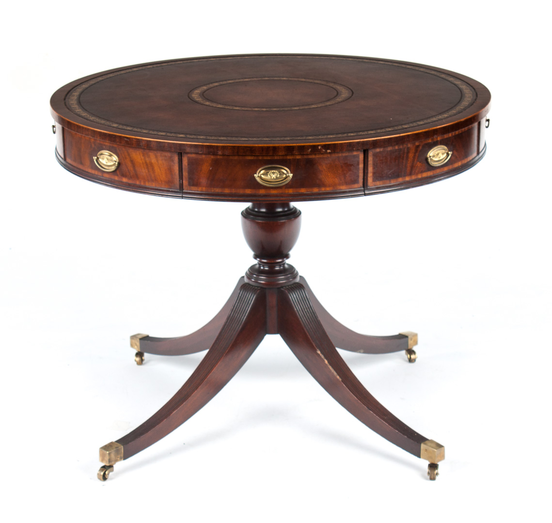 Appraisal: Sheraton style mahogany drum table in round gilt-leather tooled top