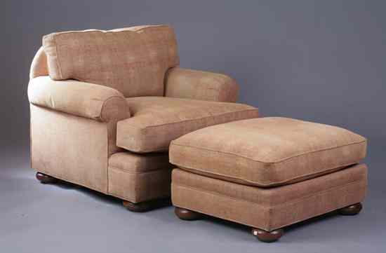 Appraisal: CONTEMPORARY LOUNGE CHAIR AND OTTOMAN Rolled arms loose T-form seat