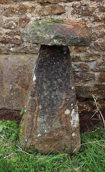 Appraisal: A LARGE OLD STADDLE STONE with rectangular spreading base cm