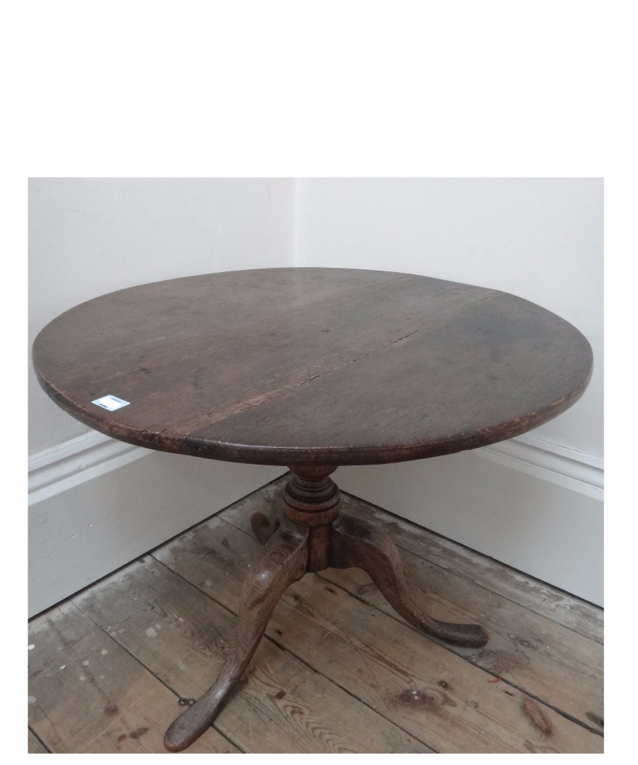 Appraisal: A George III oak tea table reduced in height the