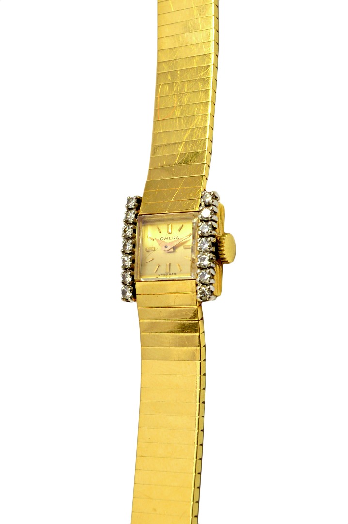 Appraisal: A lady's gold and diamond set Omega dress wristwatch the