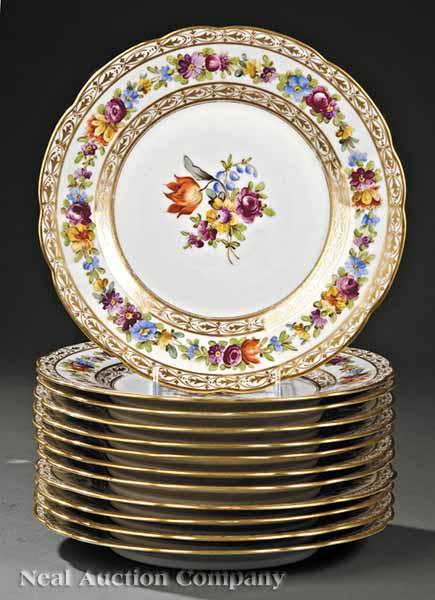 Appraisal: A Set of Twelve French Polychrome and Gilt Porcelain Plates