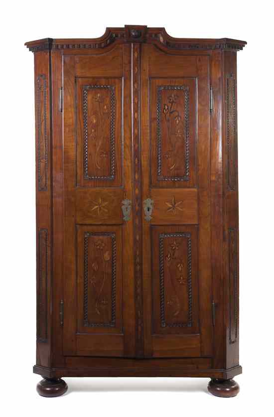 Appraisal: A Continental Fruitwood and Marquetry Armoire th century of block