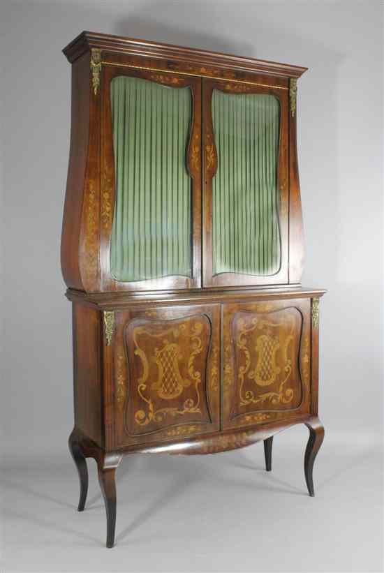 Appraisal: A late th century French marquetry inlaid mahogany cabinet on