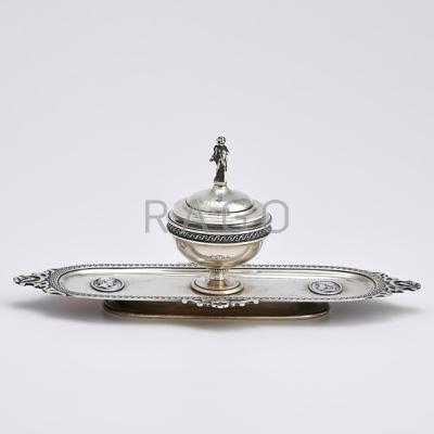 Appraisal: TIFFANY CO MEDALLION STERLING INKWELL Central cup-shaped well figural putti