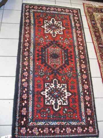 Appraisal: Heriz Persian Handmade Rug trio of geometric medallions on red