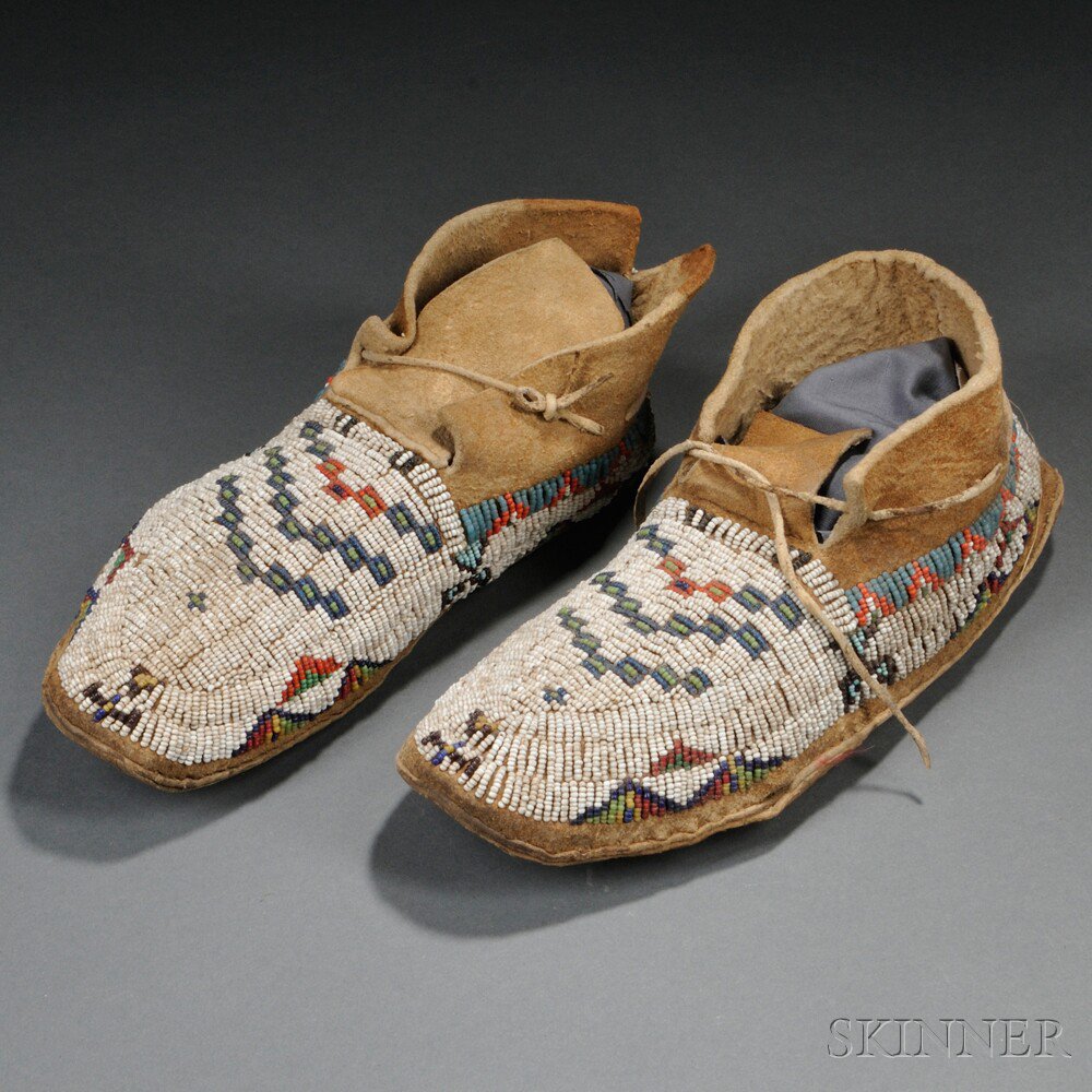 Appraisal: Pair of Lakota Beaded Hide Moccasins c multicolored geometric designs