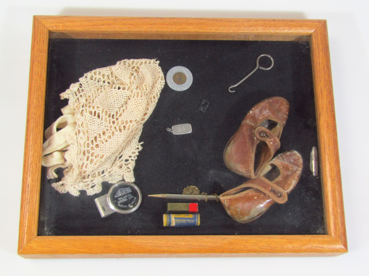 Appraisal: A glazed case containing a quantity of various bygones collectables