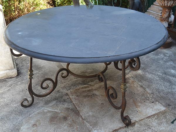 Appraisal: A CIRCULAR MARBLE TOP WROUGHT IRON BASED TABLE the top