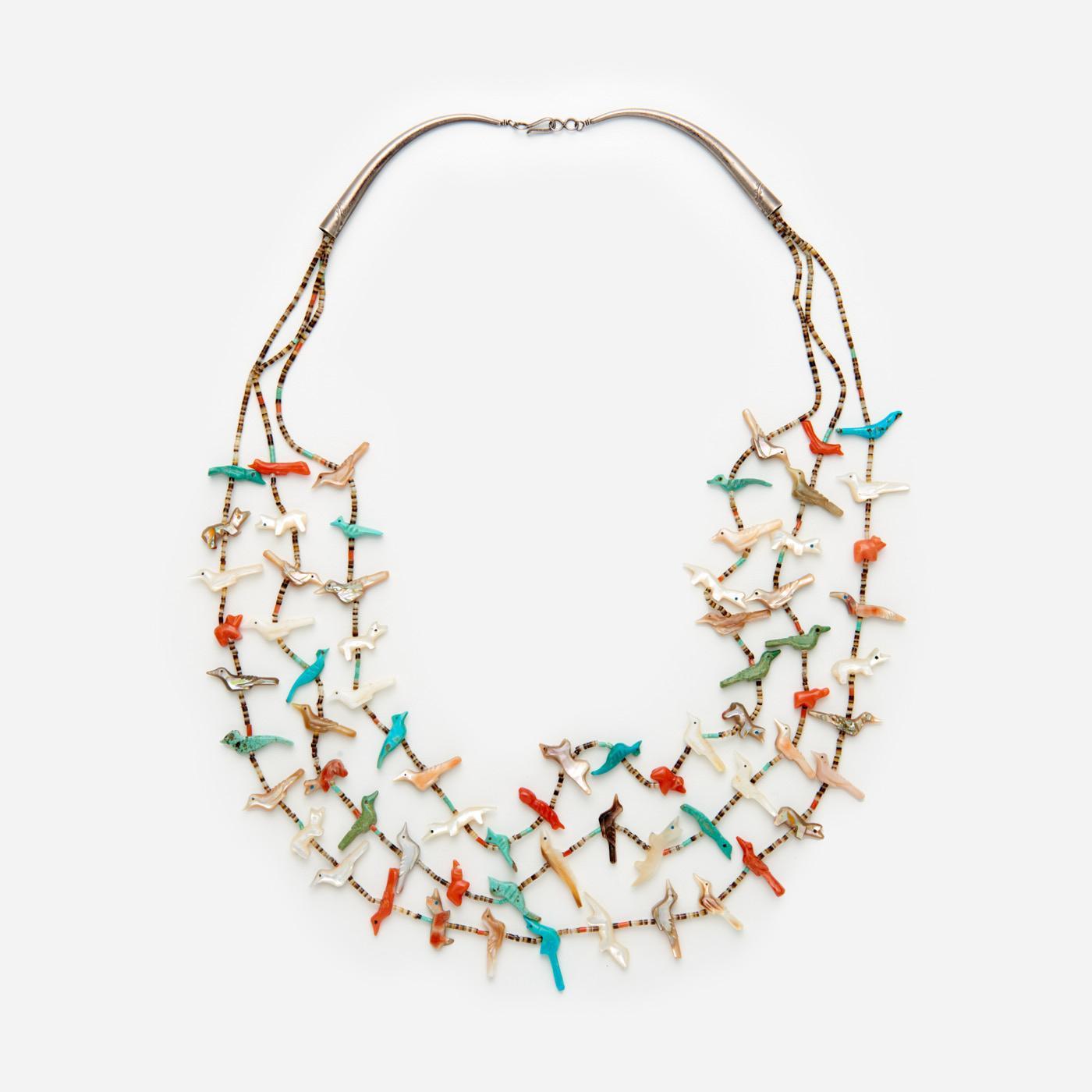 Appraisal: MULTICOLORED FETISH NECKLACE WITH BIRDS AND FOXES A three strand