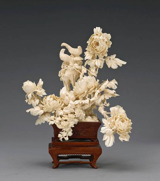 Appraisal: A pieced ivory and wood flowering branch group th Century