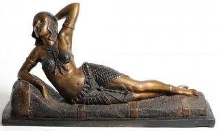 Appraisal: Art Deco The Egyptian beauty with navel-baring outfit and sculpted