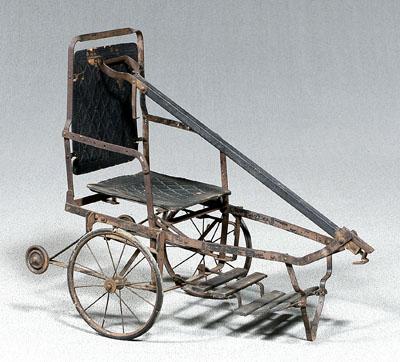 Appraisal: Outing child's wheeled chair wood and metal with spoked wheels