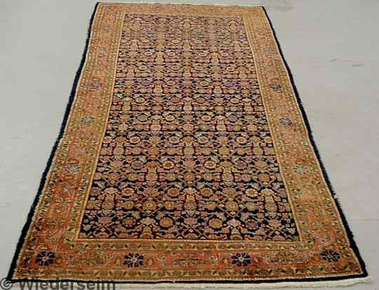 Appraisal: Bidjar oriental center hall carpet dark blue field and overall