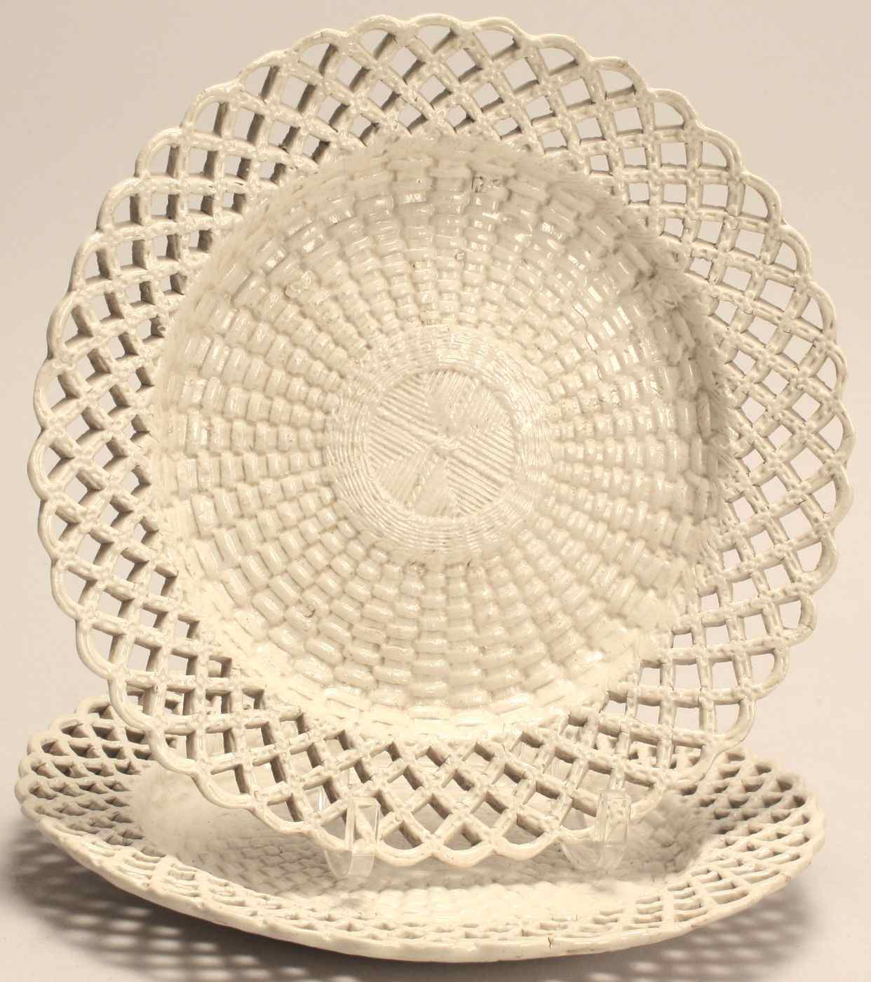 Appraisal: PAIR OF ENGLISH SOFT PASTE CREAMWARE PLATESEarly th CenturyWith lattice