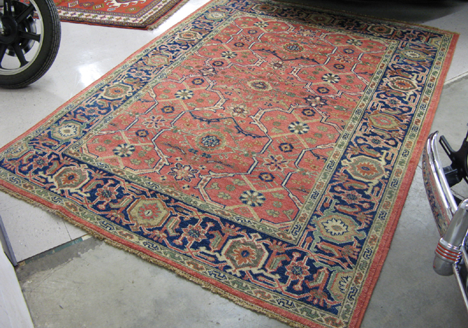 Appraisal: HAND KNOTTED ORIENTAL CARPET overall floral design on rose ground