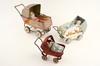 Appraisal: DOLLS - Lot of three metal painted prams each with