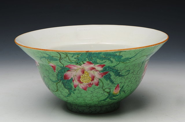 Appraisal: A CHINESE GREEN GROUND WIDE LIPPED BOWL painted with peonies