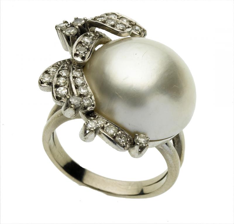 Appraisal: A DIAMOND AND MAB PEARL RING with twenty eight evenly