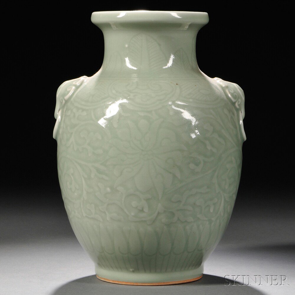 Appraisal: Celadon Vase China Qing Dynasty decorated with flowers and auspicious