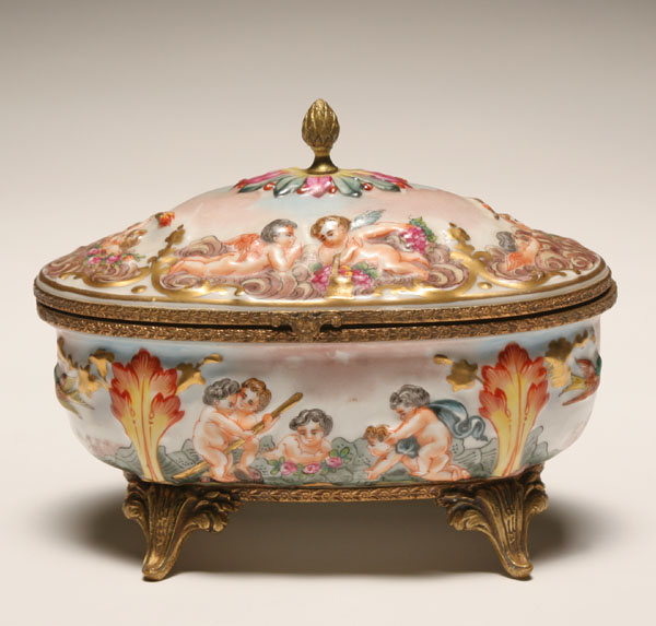 Appraisal: Capo di Monte footed casket raised putti and cupid figures