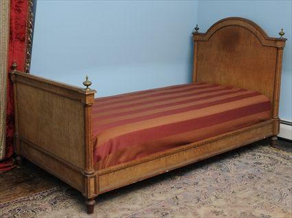 Appraisal: LOUIS XVI-STYLE BRASS-MOUNTED ASH BEDSTEAD The arched headboard flanked by