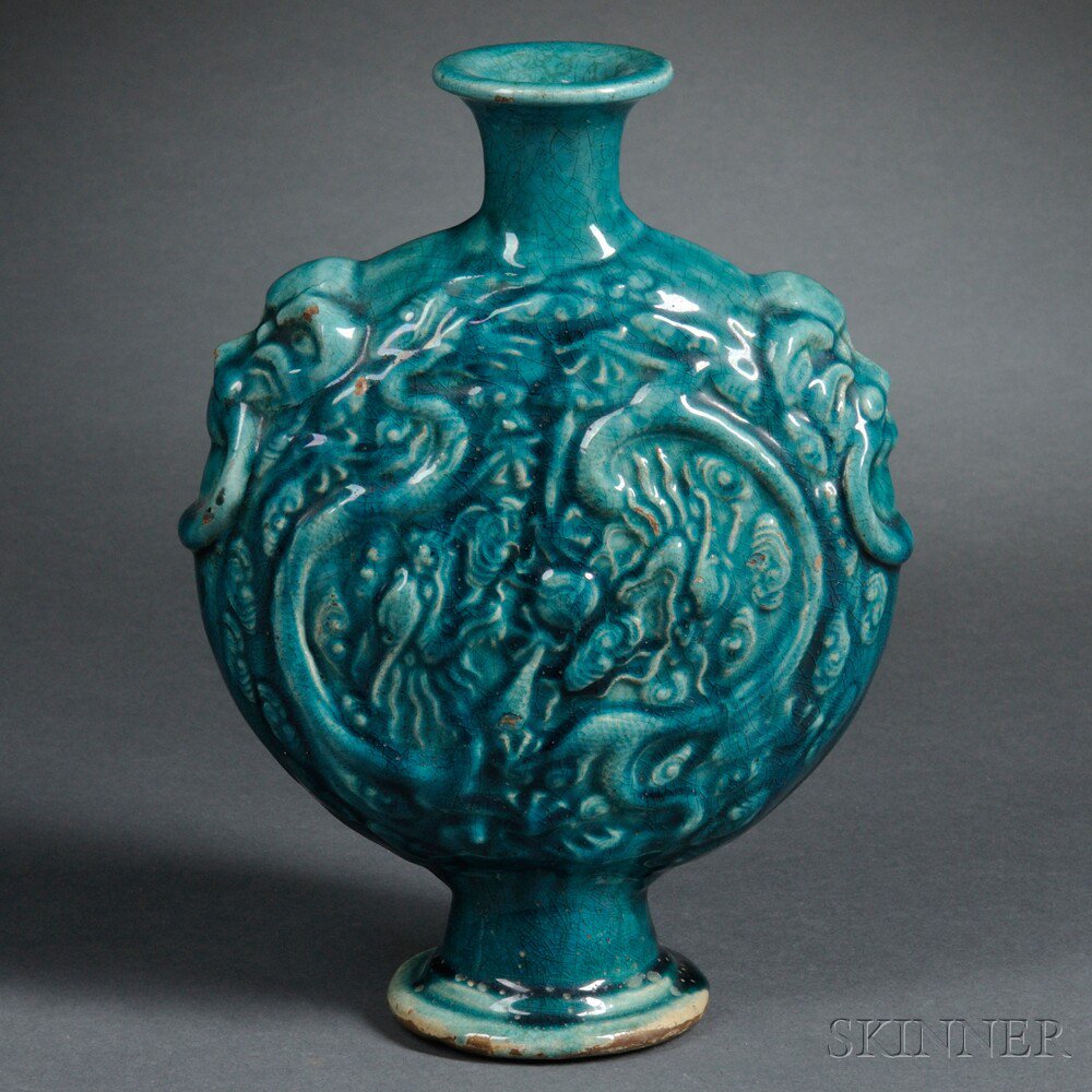 Appraisal: Turquoise-glazed Moonflask China molded with dragons chasing pearls amidst clouds