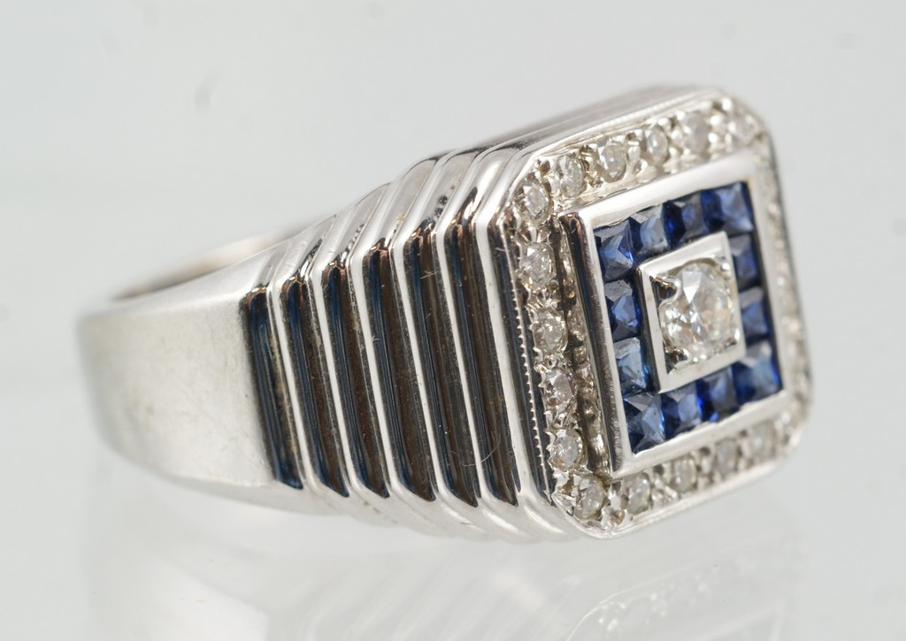 Appraisal: K YG diamond sapphire ring in a stepped top setting