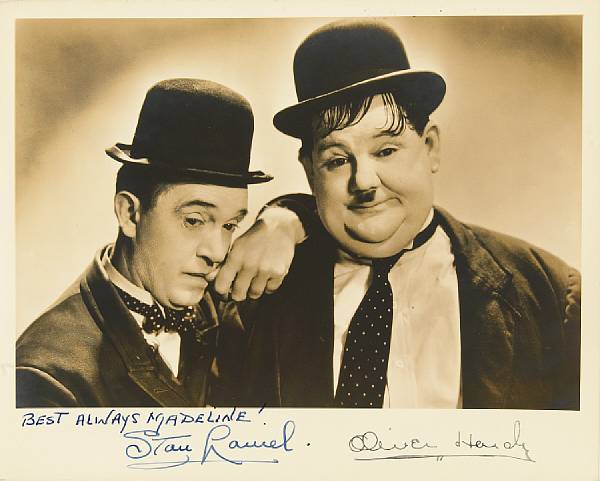 Appraisal: A Laurel and Hardy signed sepia photograph s A vintage