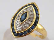 Appraisal: A yellow metal tests carat gold marquise shape sapphire and