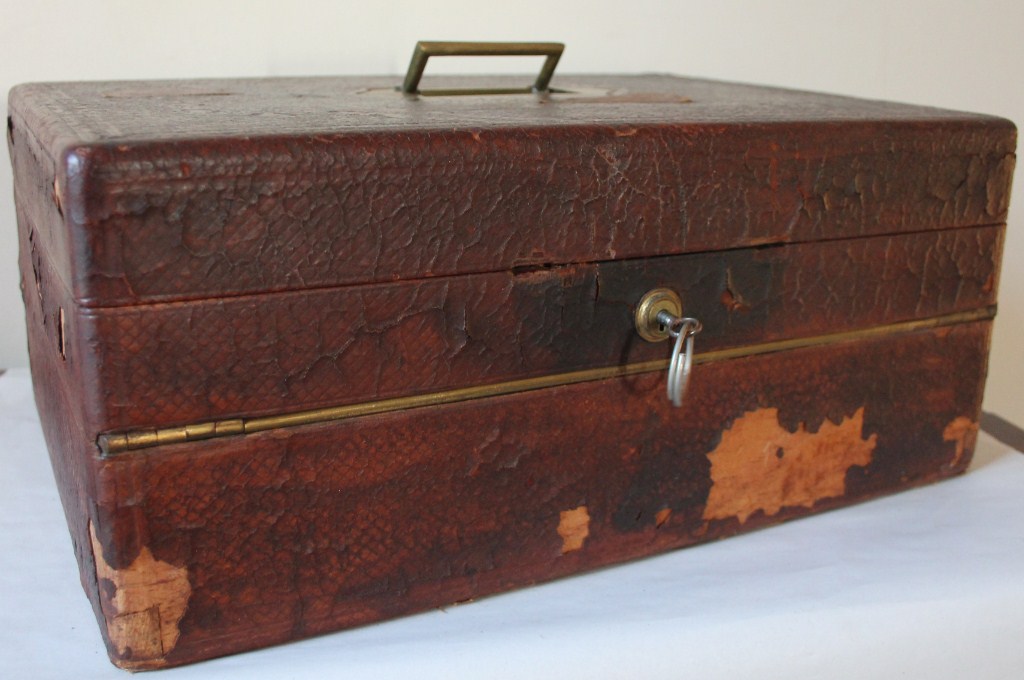 Appraisal: A Victorian leather writing box by Allen Strand revealing photographic