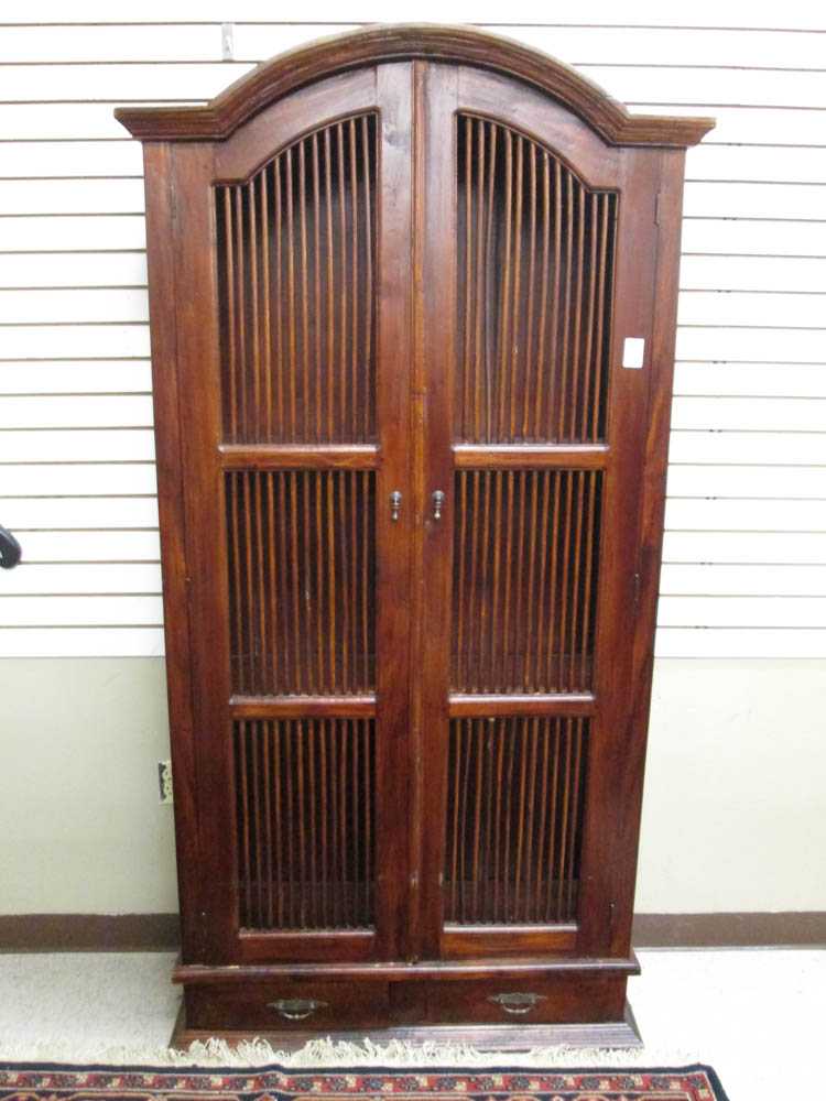 Appraisal: DUTCH COLONIAL STYLE STORAGE CABINET Indonesian th century the sides