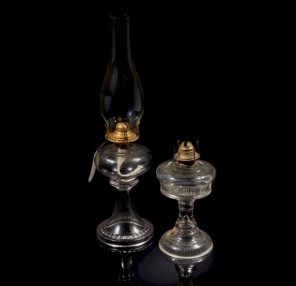 Appraisal: Two Oil Lamps Two glass oil lamps one having a