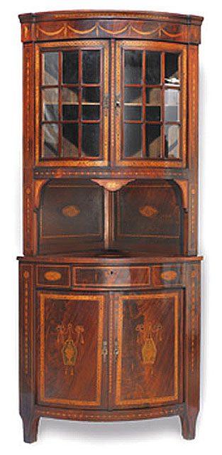 Appraisal: A mid th century Continental mahogany and marquetry corner cabinet