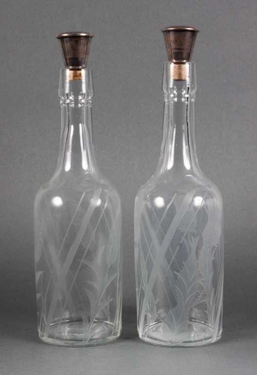 Appraisal: Pair of etched glass bottle-form decanters with Watson sterling silver