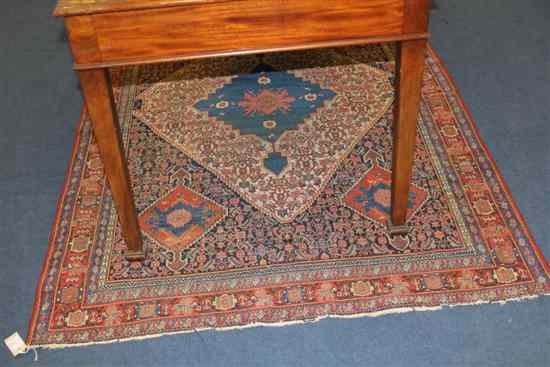 Appraisal: A Caucasian rug with central stepped diamond lozenge and four