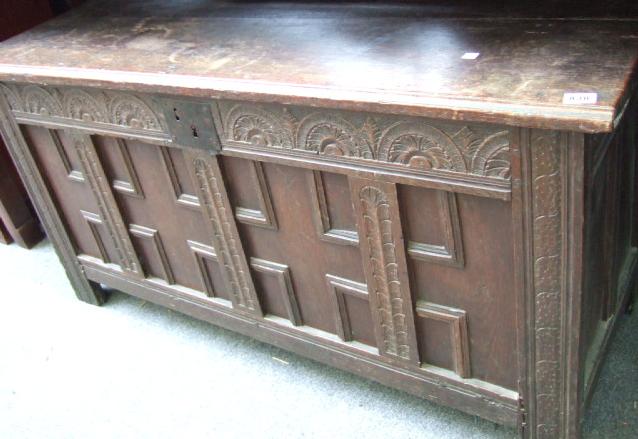 Appraisal: n th century coffer the plank top over four panel