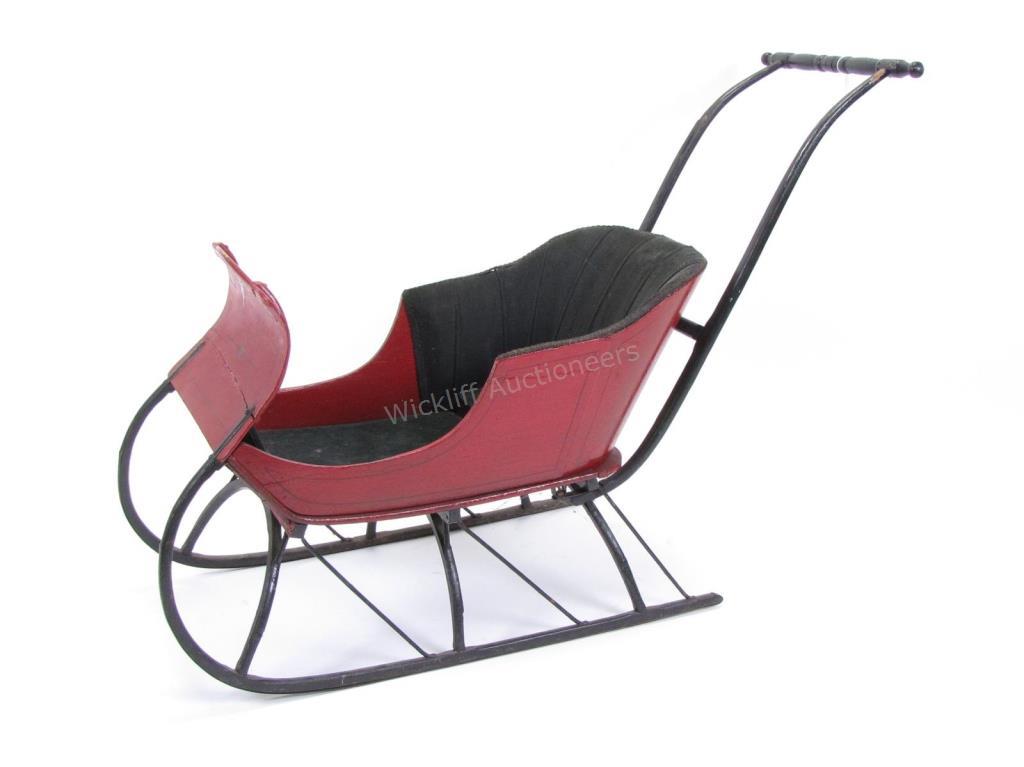 Appraisal: An antique child's size push sleigh with red painted body