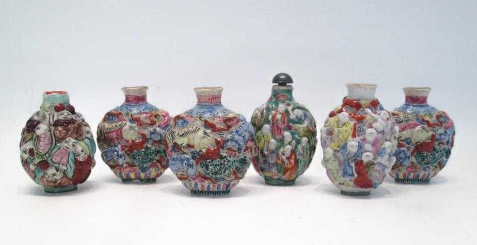 Appraisal: SIX CHINESE MOLDED PORCELAIN SNUFF BOTTLES depicting dragons and immortals