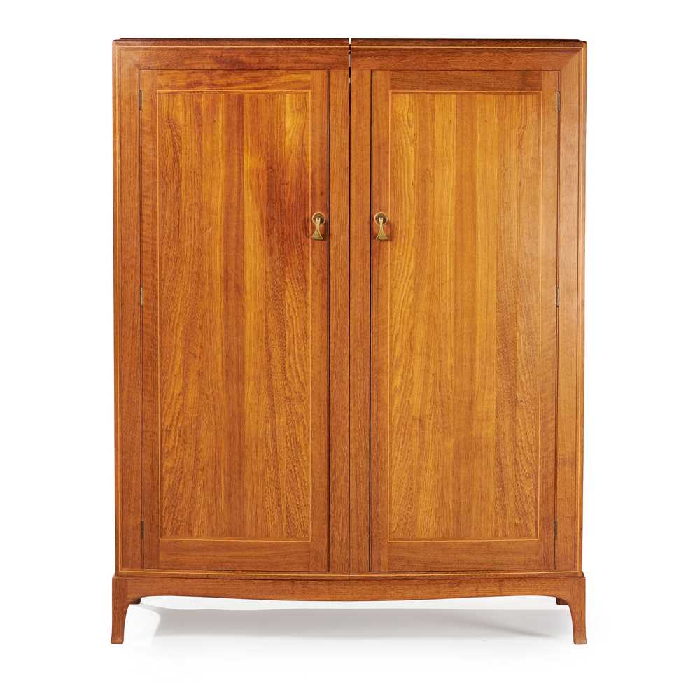 Appraisal: EDWARD BARNSLEY - BOW-FRONT WARDROBE CIRCA Australian blackbean with sycamore