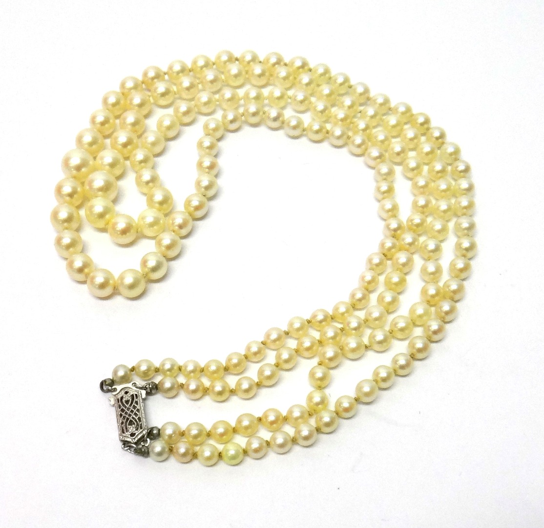 Appraisal: A two row necklace of cultured pearls graduating in size