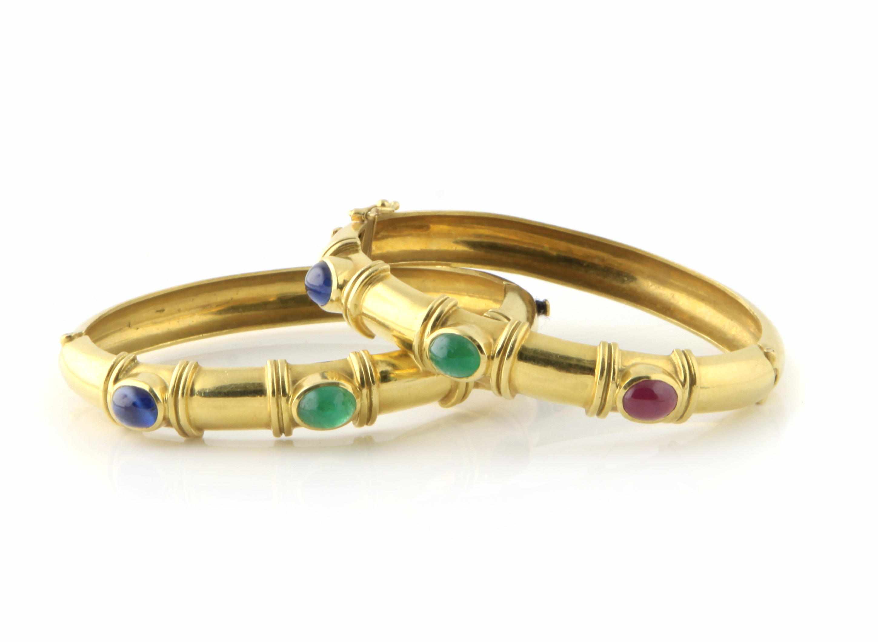 Appraisal: Two gem-set and gold gemstone bangles g gross