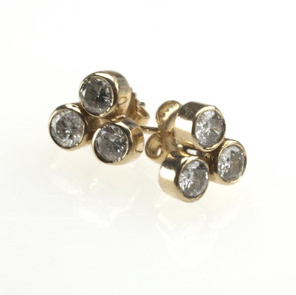 Appraisal: THREE-STONE DIAMOND EARRINGS Set in k yg Diamonds cts TW