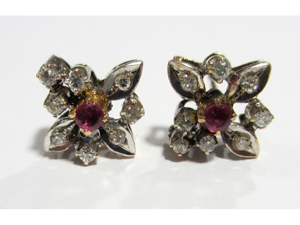 Appraisal: A pair of bi colour gold ruby and diamond flower