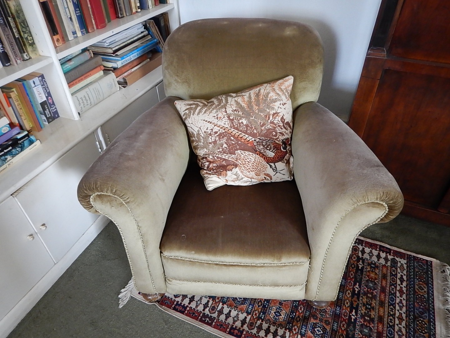 Appraisal: A s upholstered armchair in green plush material on bun