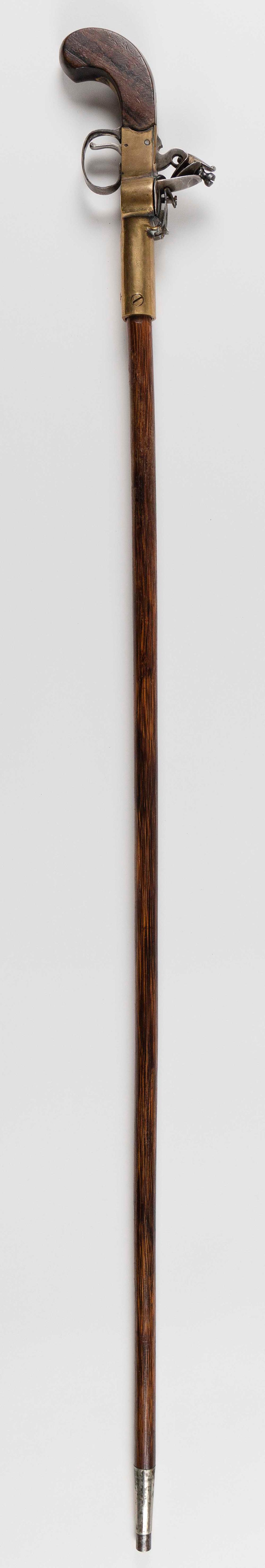 Appraisal: PISTOL-HANDLE WALKING STICK TH TH CENTURY LENGTH PISTOL-HANDLE WALKING STICK