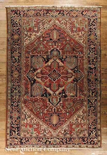 Appraisal: A Semi-Antique Heriz Carpet red and blue ground central medallion