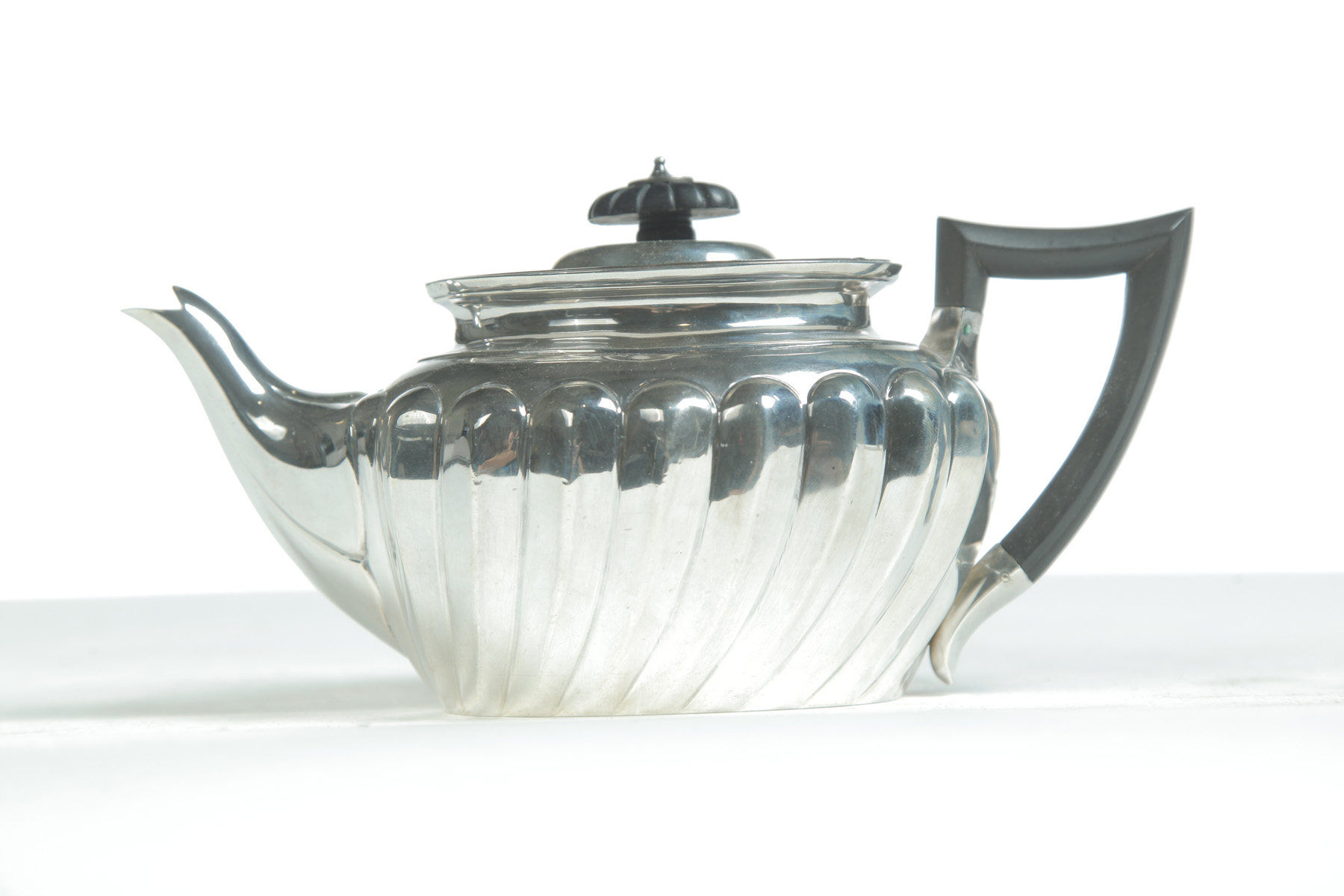 Appraisal: STERLING SILVER TEAPOT London th quarter- th century Ebony finial