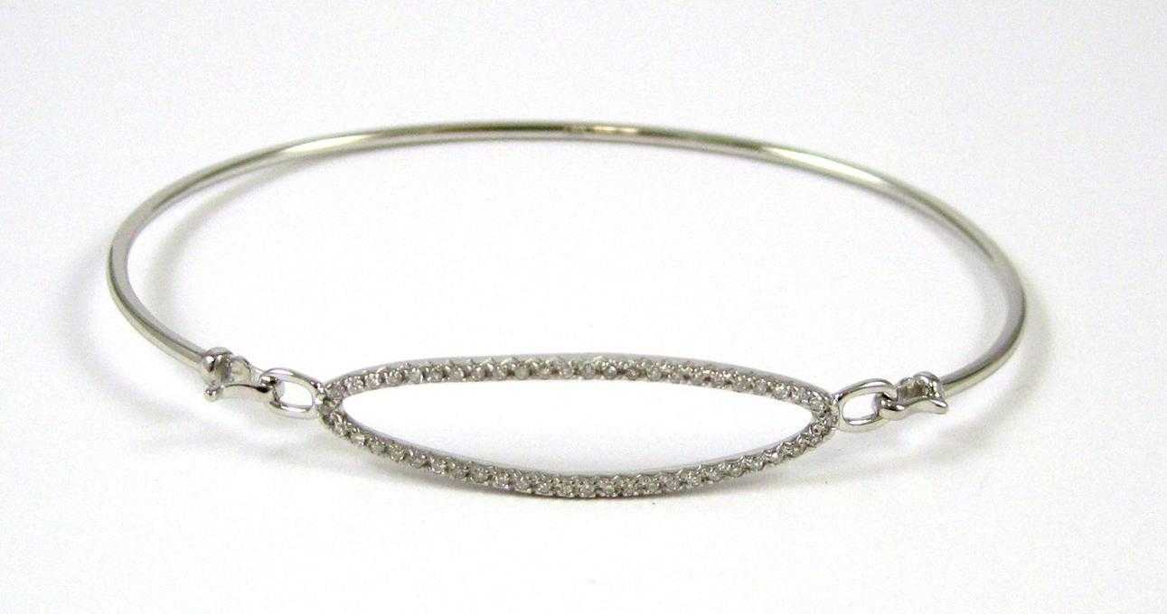 Appraisal: DIAMOND AND FOURTEEN KARAT GOLD BANGLE The white gold bangle